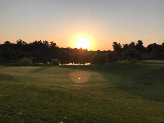 A sunset view of a hole at Turkey Creek Golf Club.