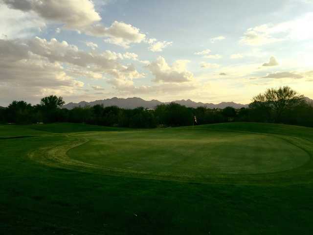 A sunset view of a green from Coyote Wash Golf Course.