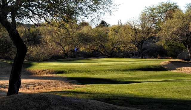 A sunny day view of a hole at San Ignacio Golf Club.