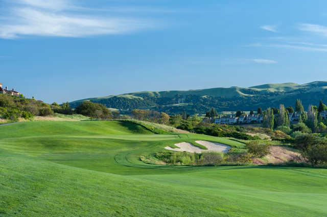 A sunny day view of a hole at The Bridges Golf Club.