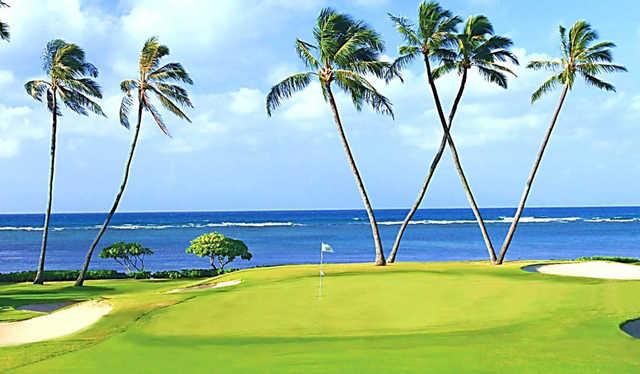 A sunny day view of a hole at Waialae Country Club.