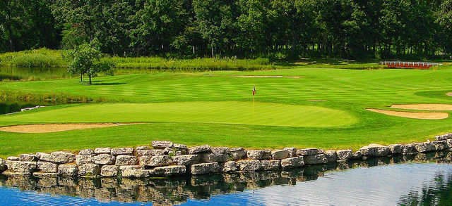 A view of a green with water and bunkers coming into play at Cantigny Golf.