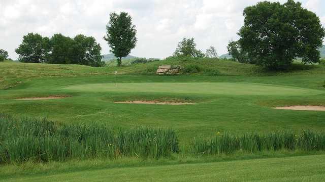 A view of a green surrounded by bunkers at East Course from Eagle Ridge Resort & Spa.