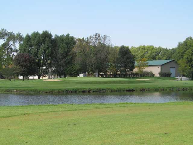 A view over the water of a hole at Green Garden Country Club.