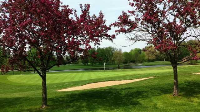 A spring day view of a hole at Oak Brook Golf Club.