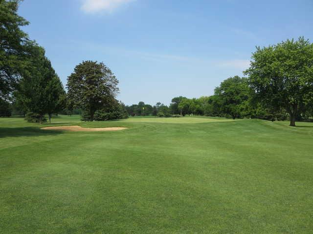 A sunny day view of a hole at Palatine Hills Golf Course.