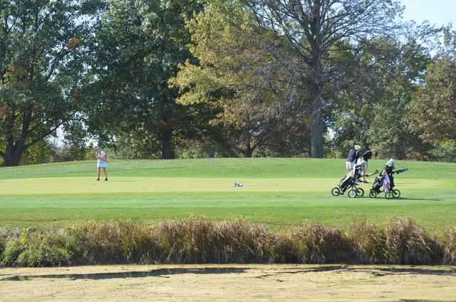 A sunny day view of a hole at Hickory Point Golf Course.