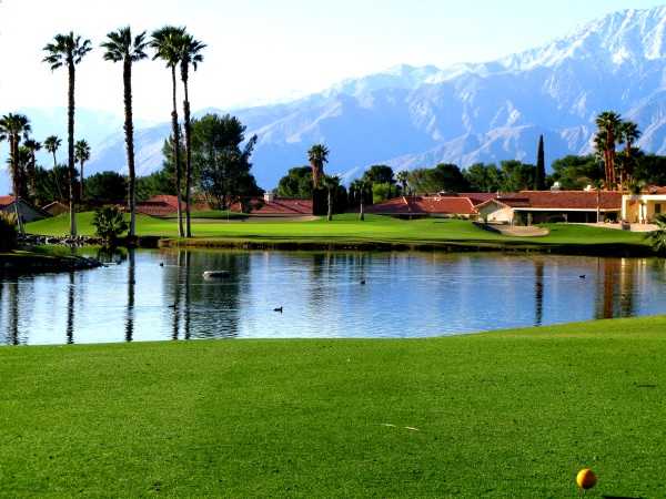 A view over the water of the 2nd green at Mission Lakes Country Club