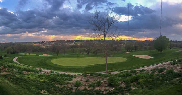 A sunset view of a green at Benson Park Golf Course.