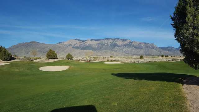 A sunny day view of a hole at Sandia Golf Club.