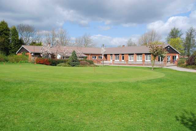 View of the puttin green and clubhouse at Edwalton Golf Centre.