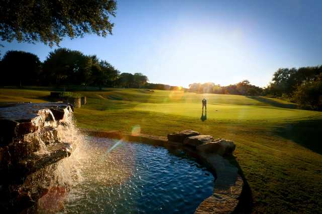 A sunny day view of a green at Avery Ranch Golf Club.