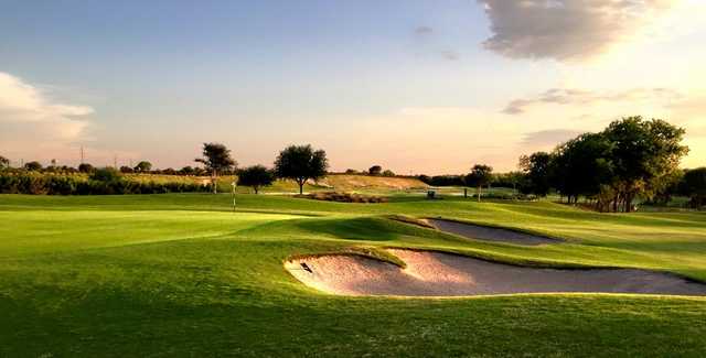 A sunny day view of a green at Star Ranch Golf Course.
