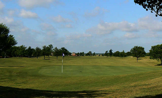 A sunny day view of a green at Waterview Golf Club.