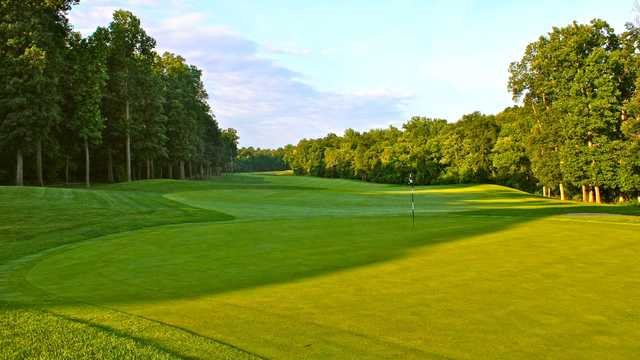 A sunny day view of a hole at Bull Run Golf Club.