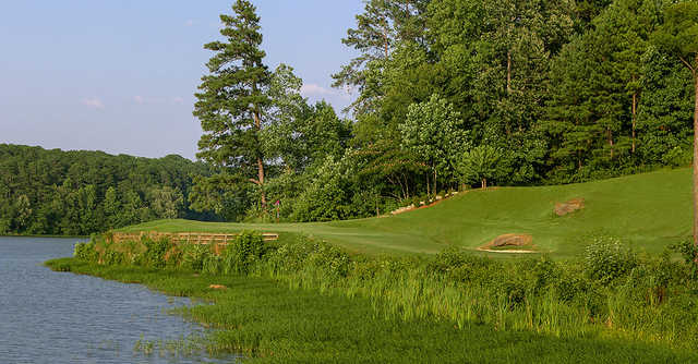 A sunny day view of a hole at Cobblestone Golf Course.