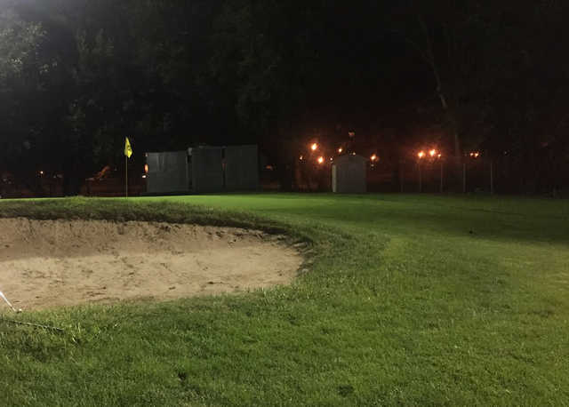 An evening view of a hole at Flushing Meadows Pitch & Putt.
