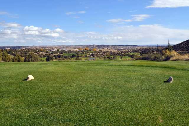 A sunny day view from a tee at Pinon Hills Golf Course.