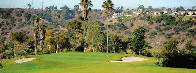 A sunny day view of a hole flanked by bunkers at Admiral Baker Golf Course.