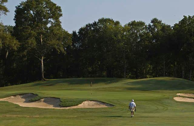 A view of a green flanked by bunkers at Santa Maria Golf Club.