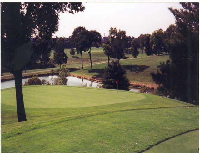 A view of the 13th green with water in background at Tanglewood Golf Course