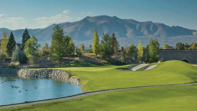 A view of a hole with water and bunkers coming into play from The Resort At Red Hawk.