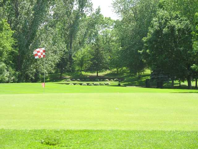 A sunny day view of a hole at New Hope Village Golf Course.