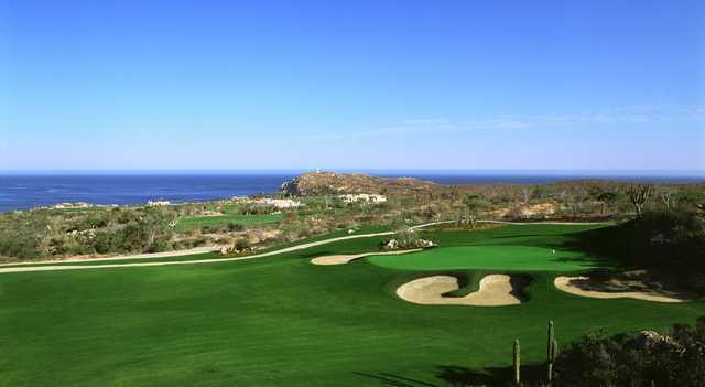 A sunny day view of a hole at Desert Golf Course from Cabo del Sol.