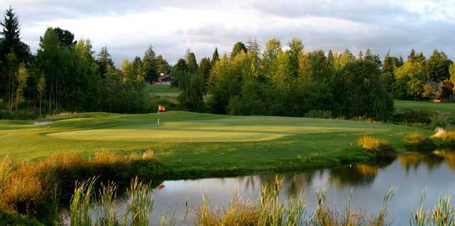 A view of a green with water coming into play at RedTail Golf Center.