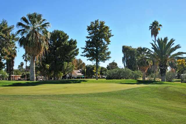 A sunny day view of a hole at Shalimar Golf Club.