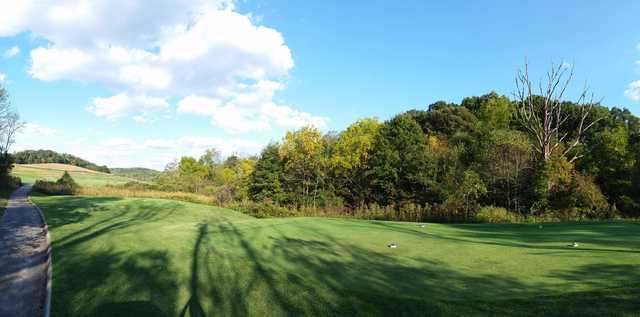 A spring day view of a tee at Virtues Golf Club.