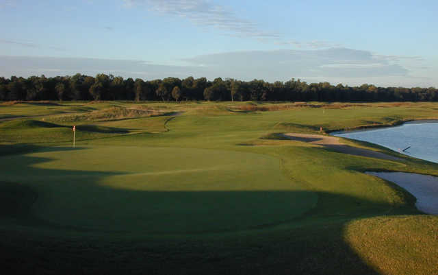 A sunny day view of a hole at River Bend Links.