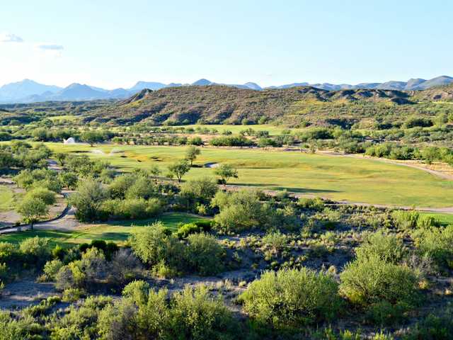 A sunny day view of a fairway at Apache Stronghold Golf Course.