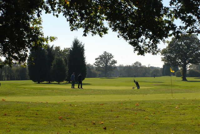A sunny day view of a hole at Horne Park Golf Club.