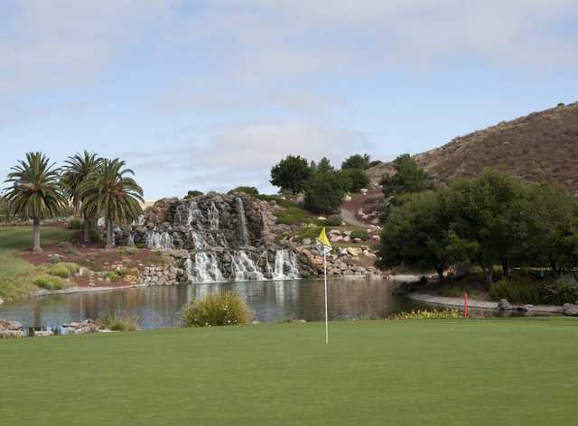 A view of the 18th green with waterfall in background at Silver Creek Valley Country Club