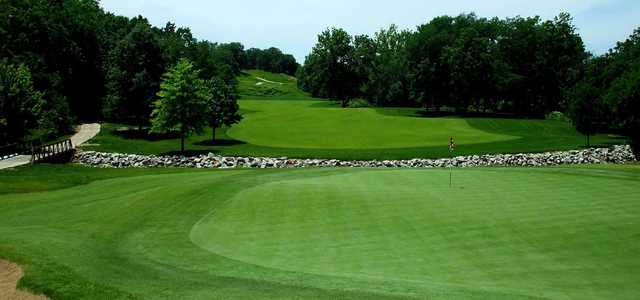 A sunny day view of a hole at Ironhorse Golf Club.