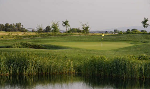 A view of a green with water coming into play at Wild Wings Golf Club.