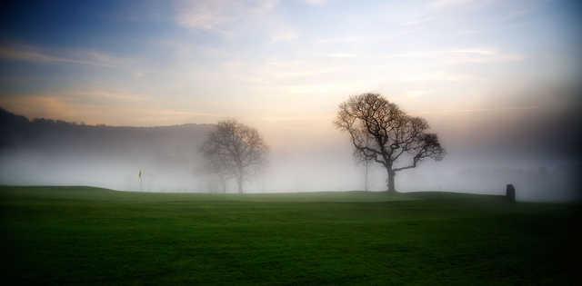 Mist over a green at St. Melyd Golf Club