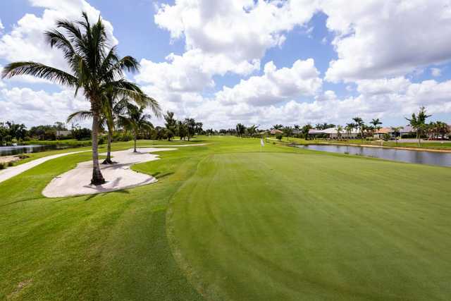 A sunny day view of a hole at Hibiscus Golf Club.