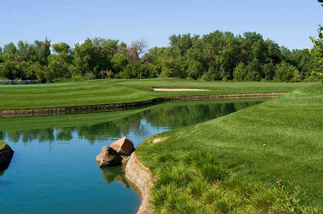 A view over the water of a hole at Los Lagos Golf Course.