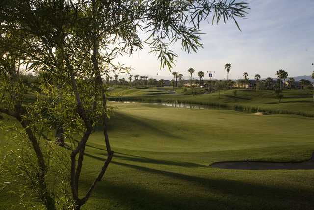 A sunny day view of a  hole at Shadow Hills Golf Club.