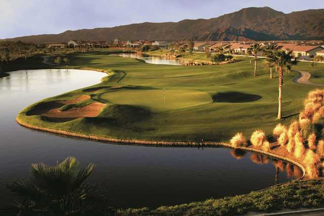 A view of a green with water and bunkers coming into play at Shadow Hills Golf Club.