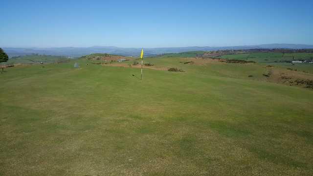 A sunny day view of a hole at Welshpool Golf Club.