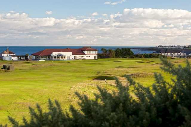 A view of the clubhouse and two greens at Kirkistown Castle Golf Club.