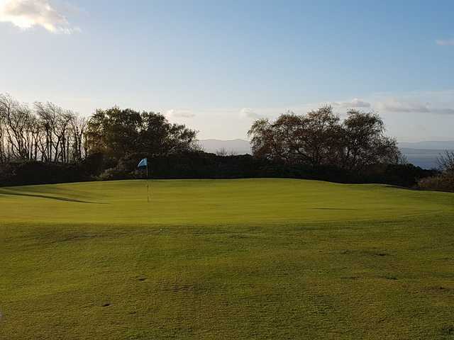 A sunny day view of a hole at Burntisland Golf House Club.
