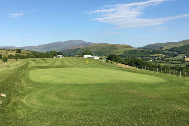 A sunny day view of a hole at Cockermouth Golf Club.
