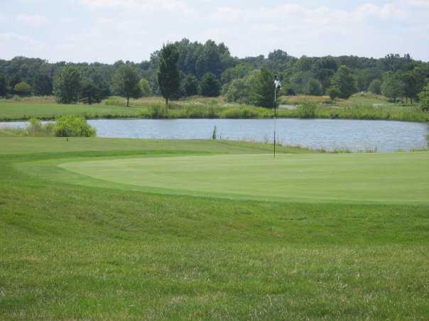 A view of the 9th green with water in background at Royal American Links Golf Club