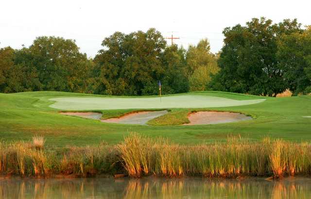 A view over the water of a hole at Wildhorse Golf Course.