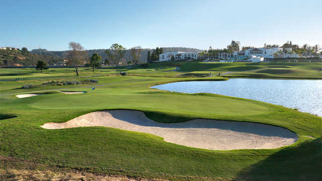 A view of a hole with water and bunkers coming into play at Champions Course from Omni La Costa Resort & Spa.