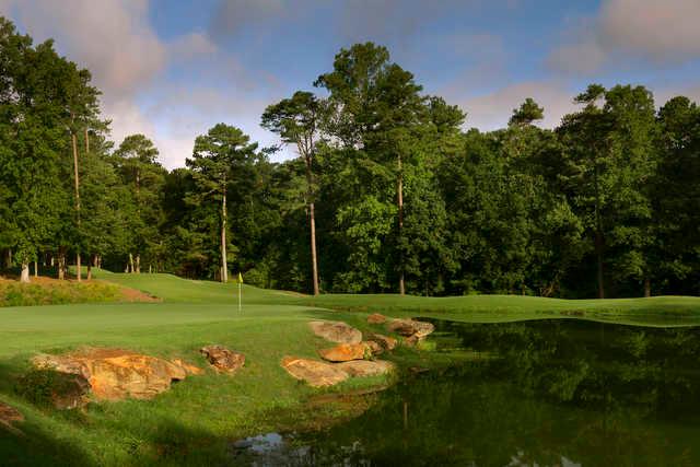 A sunny day view of a hole at Legacy Golf Links.